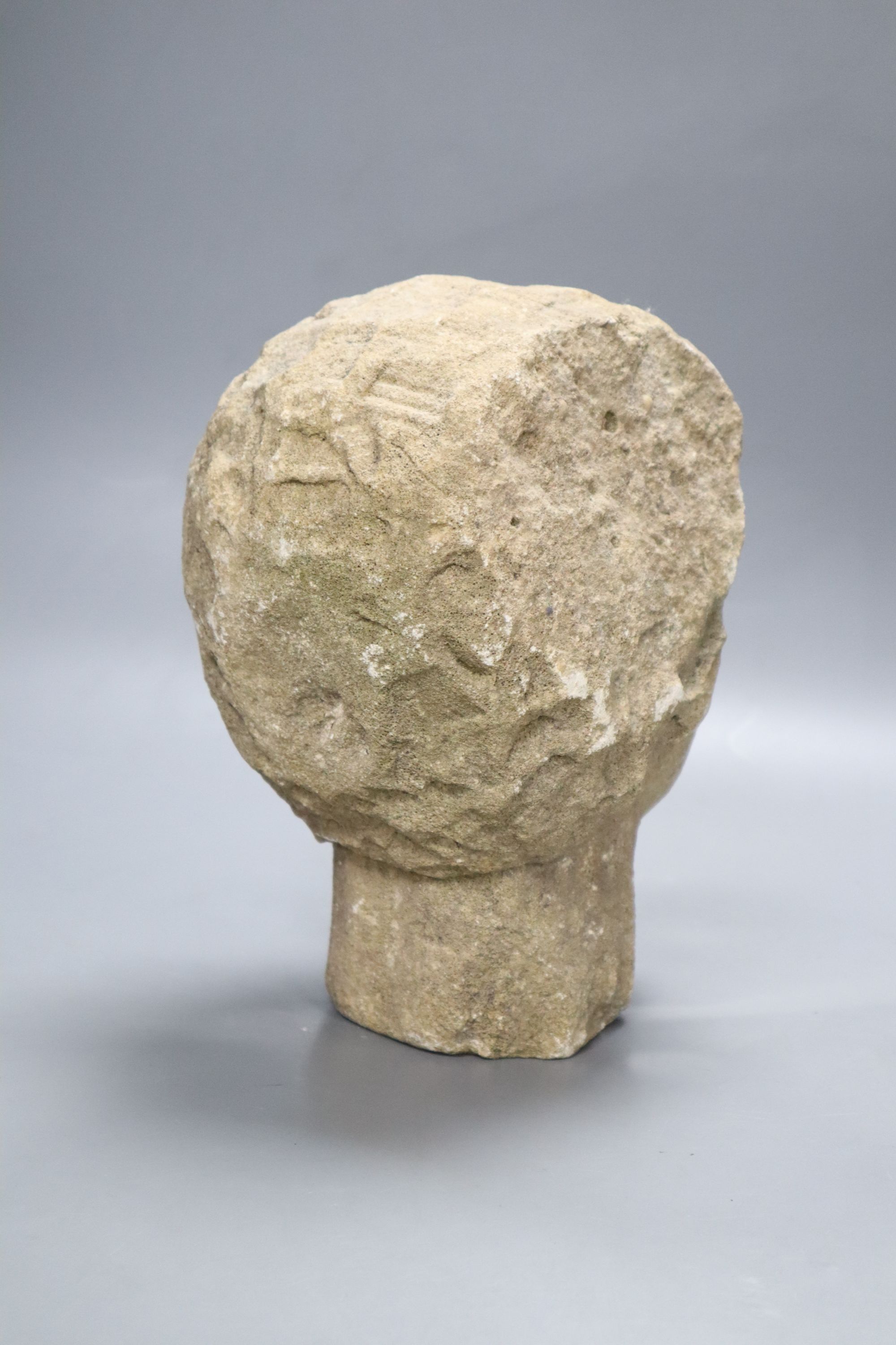 A medieval style stone head, height 23cm